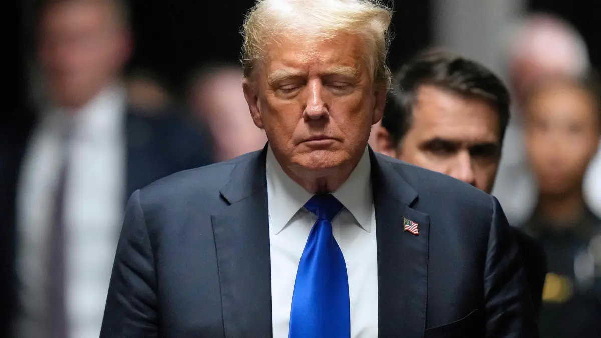 Former US President and Republican presidential candidate Donald Trump walks to speak to the press after he was convicted in his criminal trial at Manhattan Criminal Court in New York City, on May 30, 2024. A panel of 12 New Yorkers were unanimous in their determination that Donald Trump is guilty as charged -- but for the impact on his election prospects, the jury is still out. The Republican billionaire was convicted of all 34 charges in New York on May 30, 2024, and now finds himself bidding for a second presidential term unsure if he'll be spending 2025 in the Oval Office, on probation or in jail. (Photo by Seth Wenig / POOL / AFP)