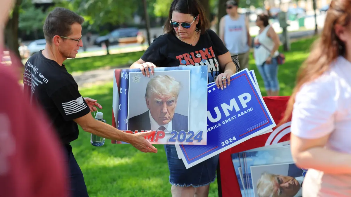 Milwaukee Prepares For The Republican National Convention: MILWAUKEE, WISCONSIN - JULY 14: People attend a vigil for Republican presidential candidate former President Donald Trump at Zeidler Union Square on July 14, 2024 in Milwaukee, Wisconsin. Trump suffered minor injuries during a campaign rally on July 13 in Butler, Pennsylvania after a gunman opened fired killing one person and injuring two critically days before the start of the 2024 Republican National Convention where he is expected to formally receive the GOP nomination for the 2024 U.S. Presidential election at the RNC. Michael M. Santiago/Getty Images/AFP (Photo by Michael M. Santiago / GETTY IMAGES NORTH AMERICA / Getty Images via AFP)