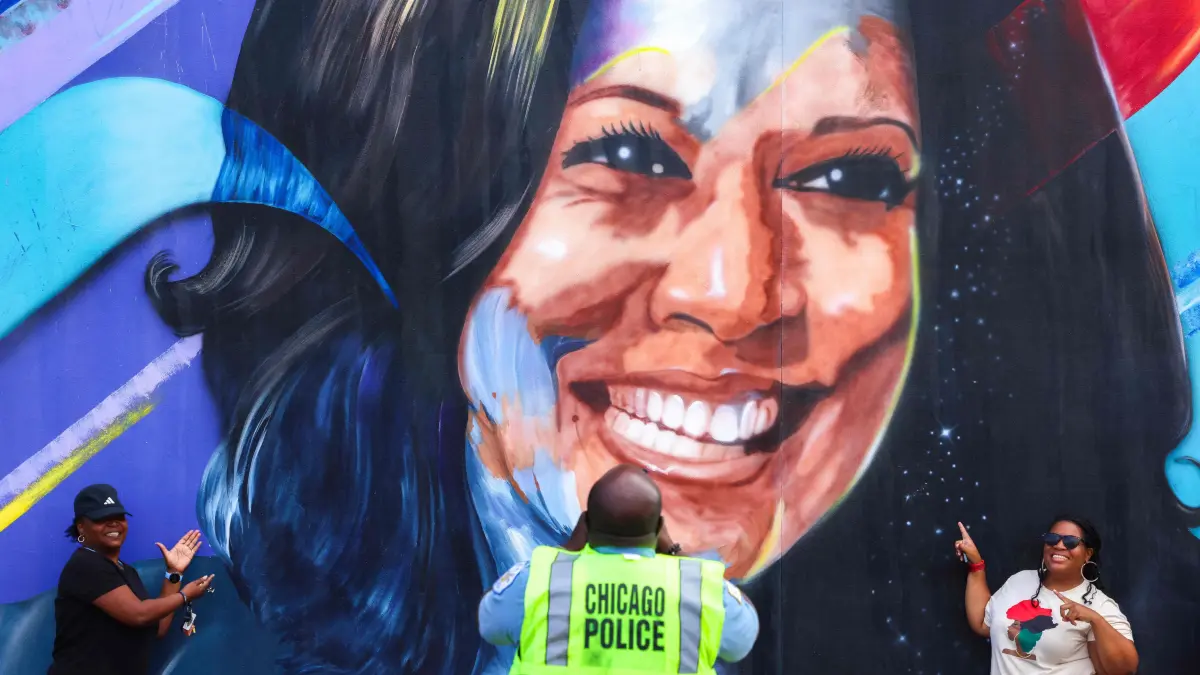 A Chicago police officer takes a picture of people posing before a mural of Democratic presidential nominee US Vice President Kamala Harris outside the United Center ahead of the Democratic National Convention (DNC) in Chicago, Illinois on August 17, 2024. The mural, created by Ian Robertson and Salt and Pique Brown, was commissioned by Emily?s List in 2020.
Vice President Kamala Harris will formally accept the party?s nomination for president at the DNC which runs from August 19-22 in Chicago. (Photo by Charly TRIBALLEAU / AFP)