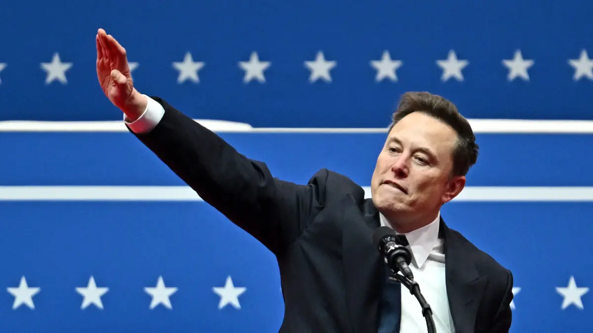 Tesla and SpaceX CEO Elon Musk gestures as he speaks during the inaugural parade inside Capitol One Arena, in Washington, DC, on January 20, 2025. (Photo by ANGELA WEISS / AFP)