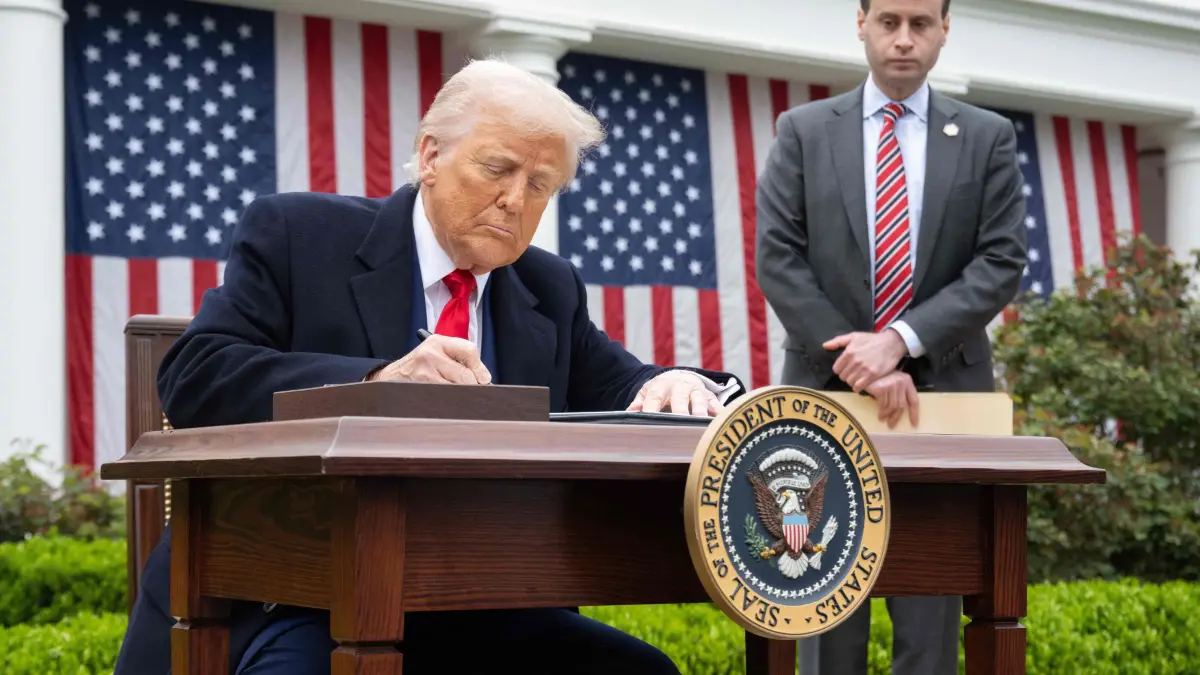 Trump delivers remarks on reciprocal tariffs: US President Donald Trump signs an executive order after delivering remarks on reciprocal tariffs during an event in the Rose Garden entitled "Make America Wealthy Again" at the White House in Washington, DC, on April 2, 2025. Trump geared up to unveil sweeping new "Liberation Day" tariffs in a move that threatens to ignite a devastating global trade war. Key US trading partners including the European Union and Britain said they were preparing their responses to Trump's escalation, as nervous markets fell in Europe and America. (Photo by SAUL LOEB / AFP)