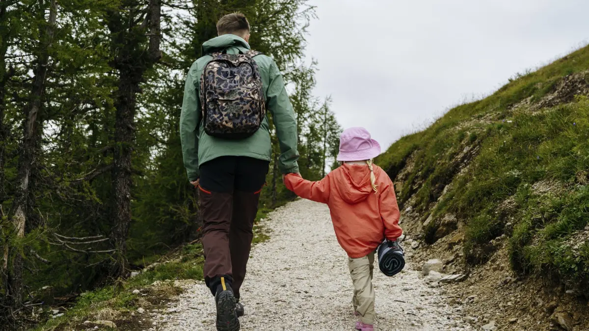 Father and daughter holding hands hiking on mountain model released, Symbolfoto, NSTF00029