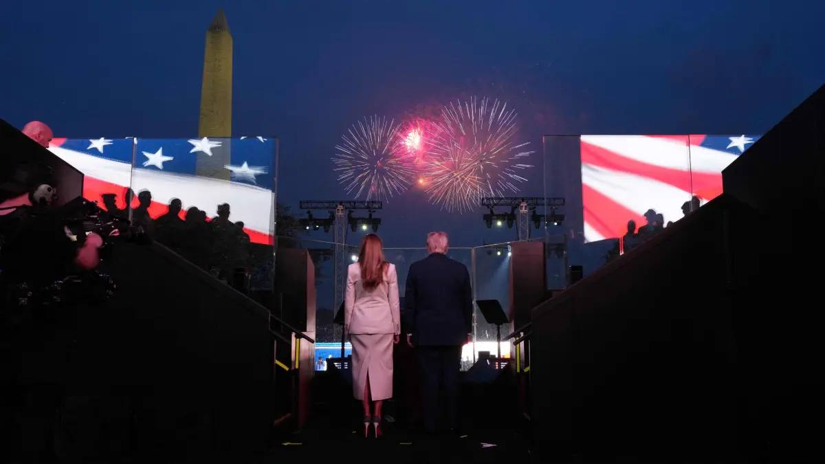 Military Parade to mark 250th anniversary of the founding of the US Army: US President Donald Trump and First Lady Melania Trump watch fireworks after the Army 250th Anniversary Parade in Washington, DC on June 14, 2025. US President Donald Trump reveled in a long dreamt-of military parade on his 79th birthday Saturday, as demonstrators across the country branded him a dictator in the biggest protests since his return to power. (Photo by Doug MILLS / POOL / AFP)