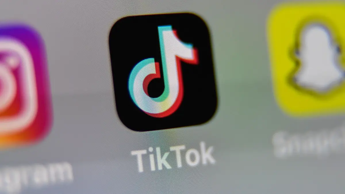 (FILES) This illustration picture taken on May 5, 2020 in Lille shows the logo of the networking application Tik ToK on the screen of a tablet. Australia will ban young teenagers from social media on December 10, 2025, launching a world-first crackdown designed to unglue children from addictive scrolling on the likes of Facebook, Instagram and TikTok. (Photo by DENIS CHARLET / AFP)