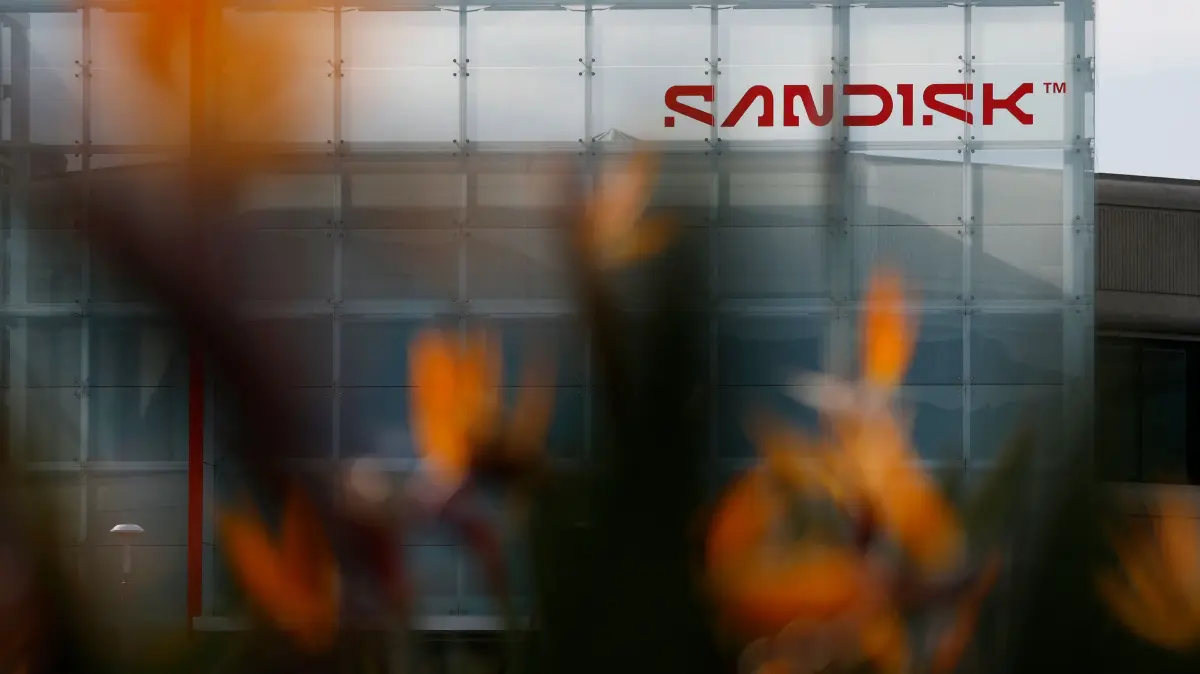 Digital Storage Company Sandisk Post Strong Quarterly Earnings: MILPITAS, CALIFORNIA - JANUARY 30: A view of SanDisk headquarters on January 30, 2026 in Milpitas, California. Shares of digital storage company SanDisk surged after the company reported second-quarter revenue of $3 billion, up 61% year over year and above estimates, while adjusted earnings jumped 404% to $6.20 a share, topping Wall Street expectations of $3.62. The company also issued a forward outlook far above analyst expectations, reinforcing investor optimism tied to strong pricing and rising AI-driven data-center demand. Justin Sullivan/Getty Images/AFP (Photo by JUSTIN SULLIVAN / GETTY IMAGES NORTH AMERICA / Getty Images via AFP)