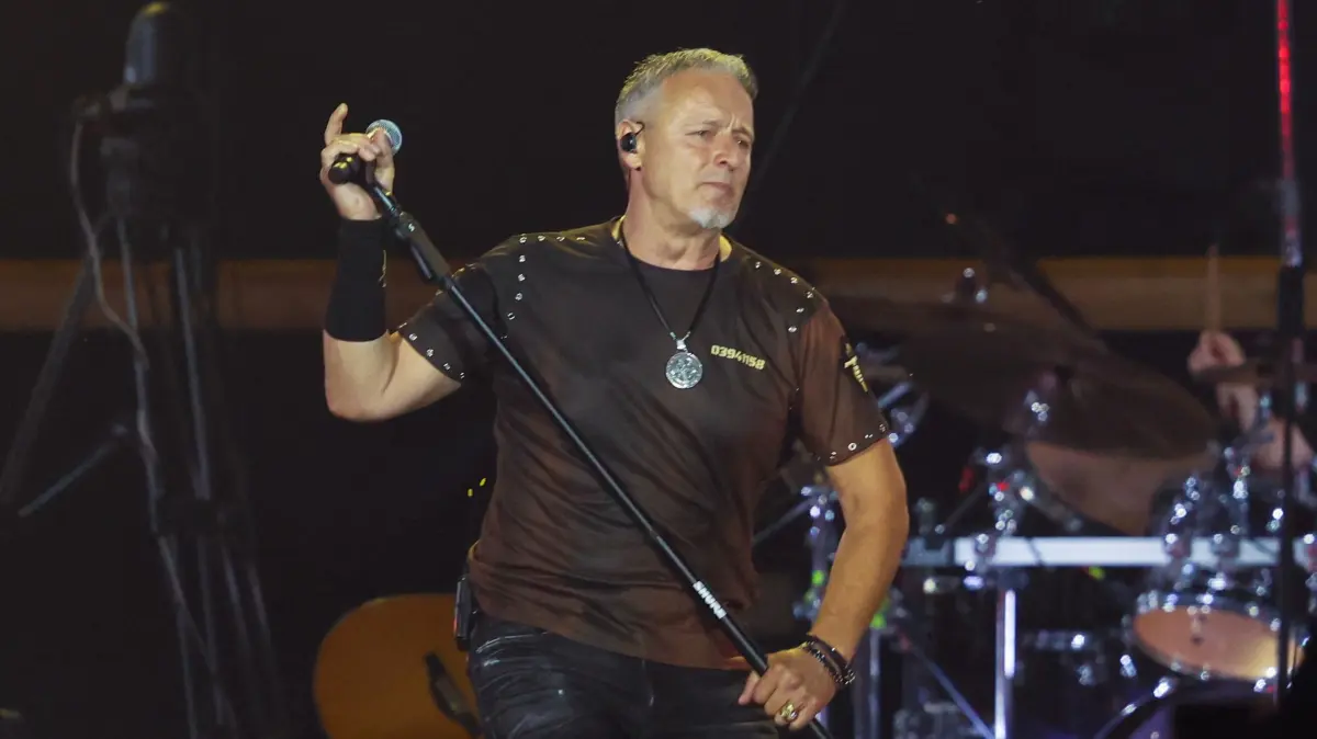 (FILES) Croatia's nationalist singer Marko Perkovic Thompson, known for his sympathies for the country's World War II Nazi-allied regime, performs during a concert at Zagreb Hipodrome, to an expected by a crowd of some 450,000 people, in Zagreb, on July 5, 2025. Bosnian judiciary has opened a preliminary investigation into two concerts given by Croatian ultranationalist singer Perkovic Thompson, after media outlets broadcast images of audience members giving the Nazi salute during the show, the prosecutor’s office said on February 19, 2026. (Photo by DAMIR SENCAR / AFP)