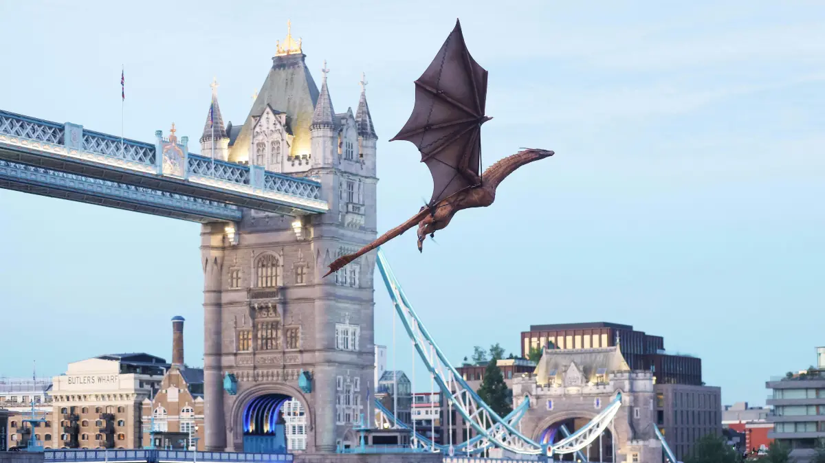 ### Strictly Embargoed Until 00:01 on 22/06/2026 ###
*** FREE FOR EDITORIAL USE ***
The largest ever model dragon soars over the Tower of London, appearing to breathe fire onto the ruins below. With an 8-metre wingspan and 23 dexterous moving parts, the remote controlled creation is based on Syrax from House of the Dragon, launching Season 3 on HBO Max this week.