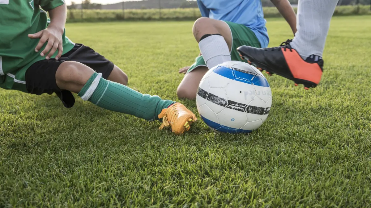 Young football players tackling on football ground model released Symbolfoto property released PUBLICATIONxINxGERxSUIxAUTxHUNxONLY WESTF24042