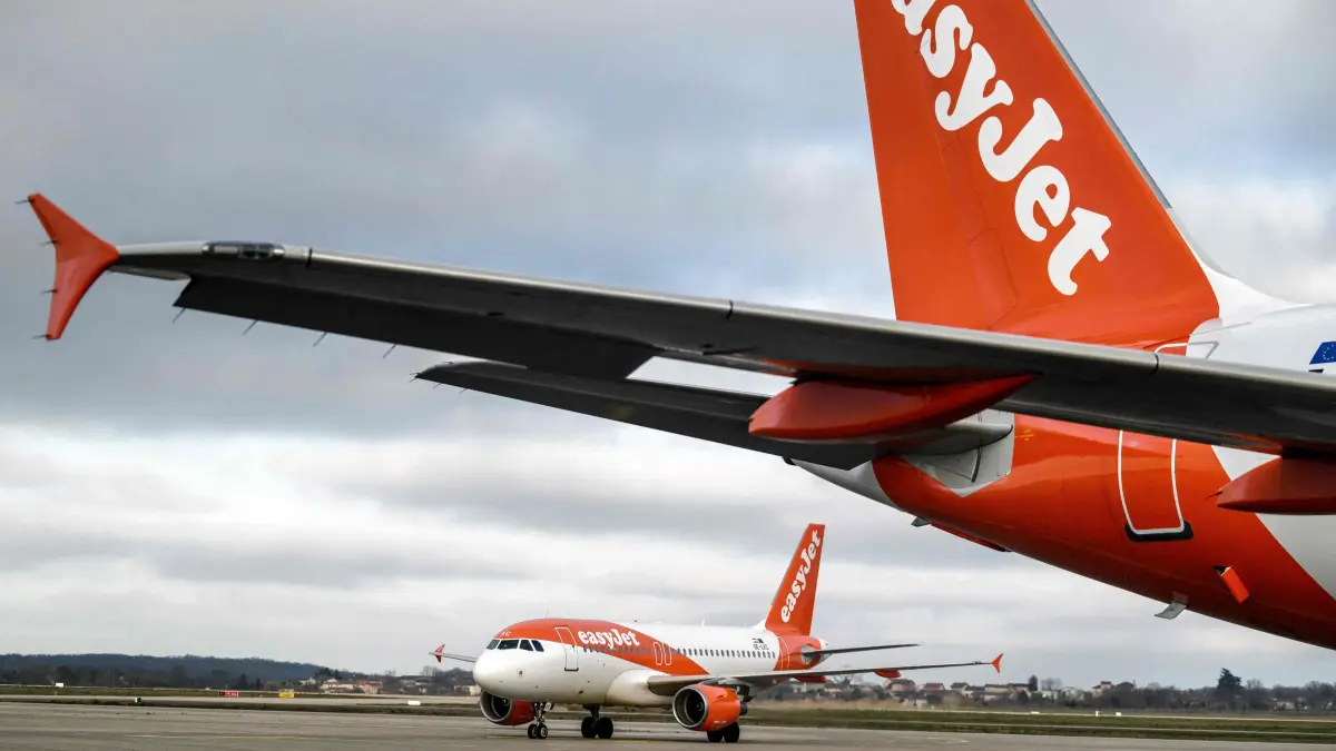 FILES-FRANCE-TRANSPORT-AVIATION-STRIKE-EASYJET: (FILES) This photograph shows EasyJet planes stand on the tarmac of the Saint Exupery Airport, in Colombier Saugnieu, southeastern France on February 5, 2024. Around 40 EasyJet flights departing from France are set to be cancelled on August 15, 2026 and "probably just as many on August 16, 2026" due to the cabin crew strike, William Bourdon, a representative of the SNPNC-FO trade union, told AFP on August 13, 2026. "Around 40 flights will be cancelled," said the union representative, confirming reports in Les Echos, and "probably just as many on August 16, 2026". (Photo by JEFF PACHOUD / AFP)