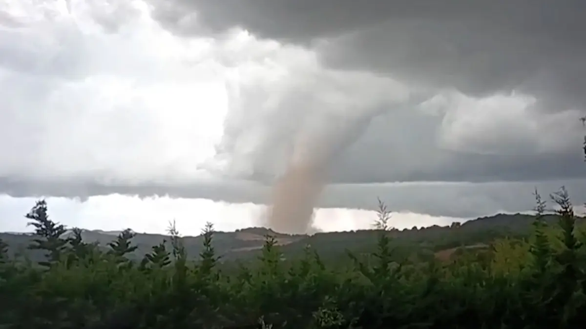 FRANCE-WEATHER-TORNADO: This video grab taken from Villefloure, shows a tornado hitting Pomas, southwestern France, on August 24, 2026. A tornado struck the Aude department on August 24 as part of southwestern France remained under an orange storm alert, with several rooftops torn off in the village of Pomas, an AFP photographer at the scene reported. (Photo by Cyrille Kaldor / UGC / AFP / AFP)