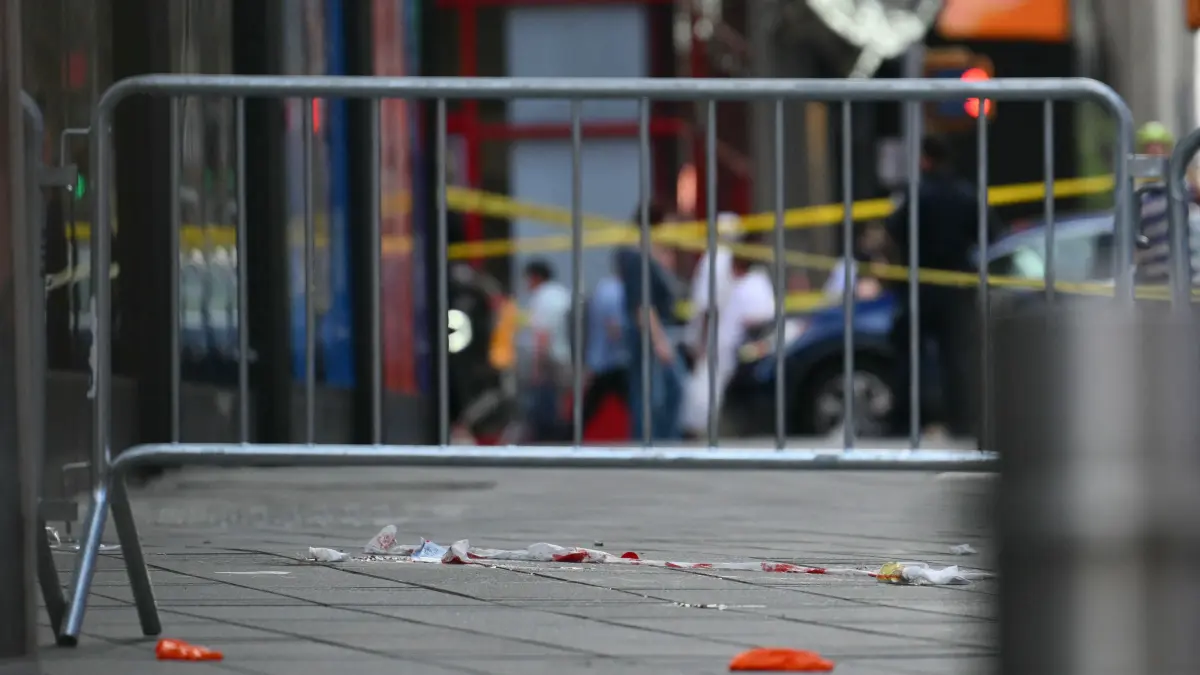 US-CRIME-SHOOTING-NEW YORK: Blood is seen at the scene where an officer-involved shooting left one dead near Times Square, in New York, on August 31, 2026. According to ABC7 New York, a woman stabbed two people before confronting police. (Photo by ANGELA WEISS / AFP)