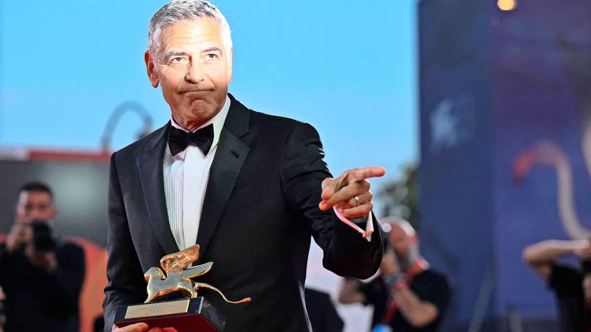 TOPSHOT - US actor and filmmaker George Clooney poses after he received the Golden Lion for Lifetime Achievement during the opening ceremony of the 83rd International Venice Film Festival, on September 2, 2026 at Venice Lido. (Photo by Tiziana FABI / AFP)