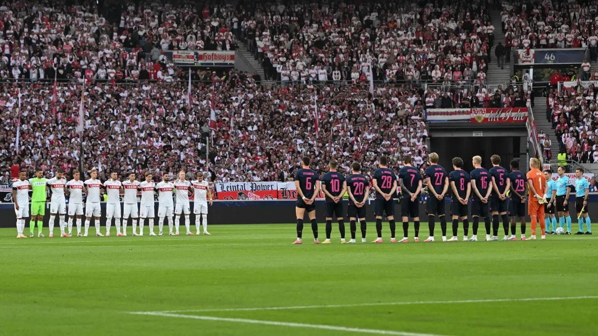 -: Players line up as the stadium observes a minute of silence for the victims of recent landslides in Nepal and China the UEFA Champions League, League phase, football match between VfB Stuttgart and Viking in Stuttgart, southern Germany, on September 9, 2026. (Photo by THOMAS KIENZLE / AFP)
