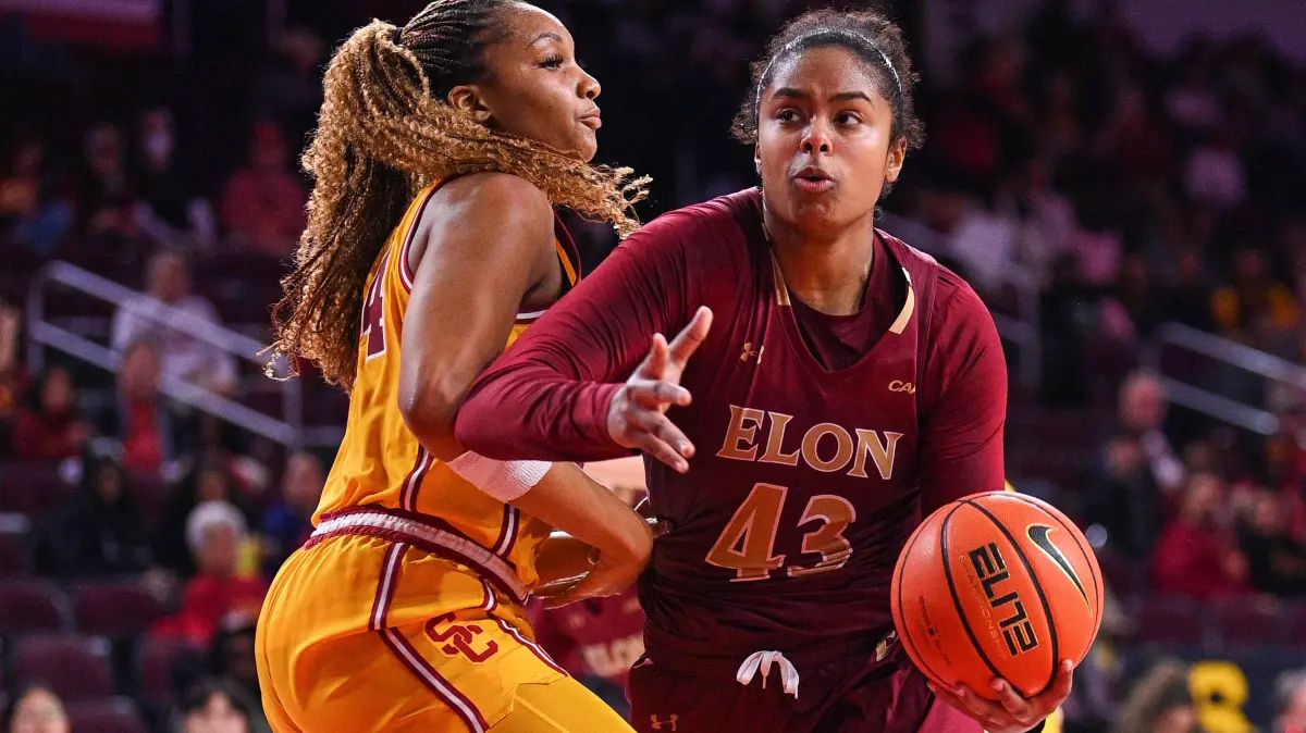 LOS ANGELES, CA - DECEMBER 15: Elon Phoenix forward Hannah Dereje 43 makes a move around USC Trojans forward Kiki Iriafen 44 during the womens college basketball game between the Elon Phoenix and the USC Trojans on December 15, 2024 at Galen Center in Los Angeles, CA. Photo by Brian Rothmuller/Icon Sportswire COLLEGE BASKETBALL: DEC 15 Women s - Elon at USC EDITORIAL USE ONLY Icon241215022