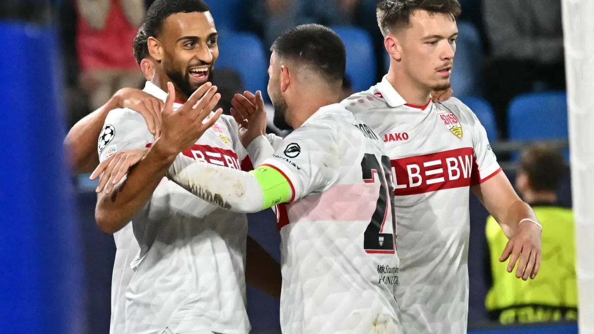 Football: UEFA Champions League - 1st round day 2: Slovan Bratislava (SVK) v VfB Stuttgart (GER): Stuttgart's players celebrate leading 0:2 after Slovan Bratislava scored an own goal during the UEFA Champions League - 1st round day 2 - football match SK Slovan Bratislava v VfB Stuttgart in Bratislava, Slovakia on October 14, 2026. (Photo by Joe Klamar / AFP)