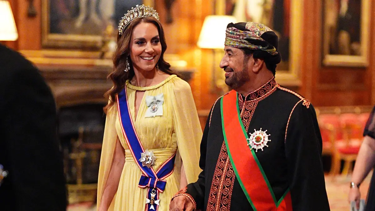 BRITAIN-OMAN-ROYALS-DIPLOMACY: Britain's Catherine, Princess of Wales walks with Khalid bin Hilal Al Busaidi, as they walk in procession to the State Banquet at Windsor Castle, Windsor, on October 20, 2026, the first day of a three-day State Visit to the United Kingdom by The Sultan of Oman. (Photo by Aaron Chown / POOL / AFP)
